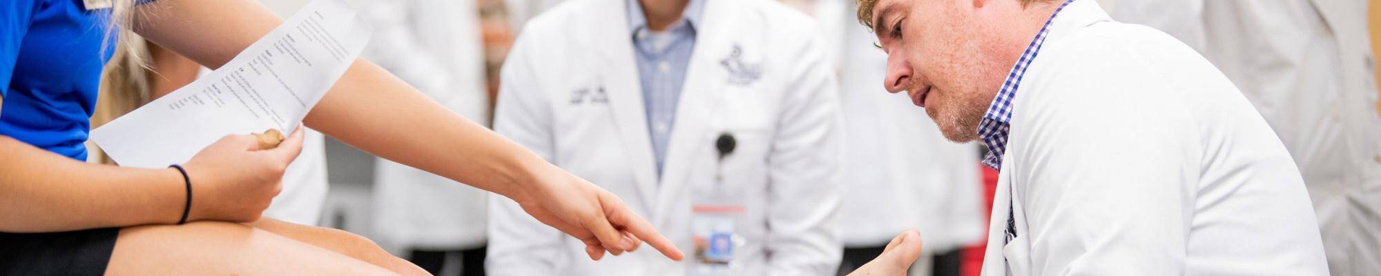 Doctor looking at ankle